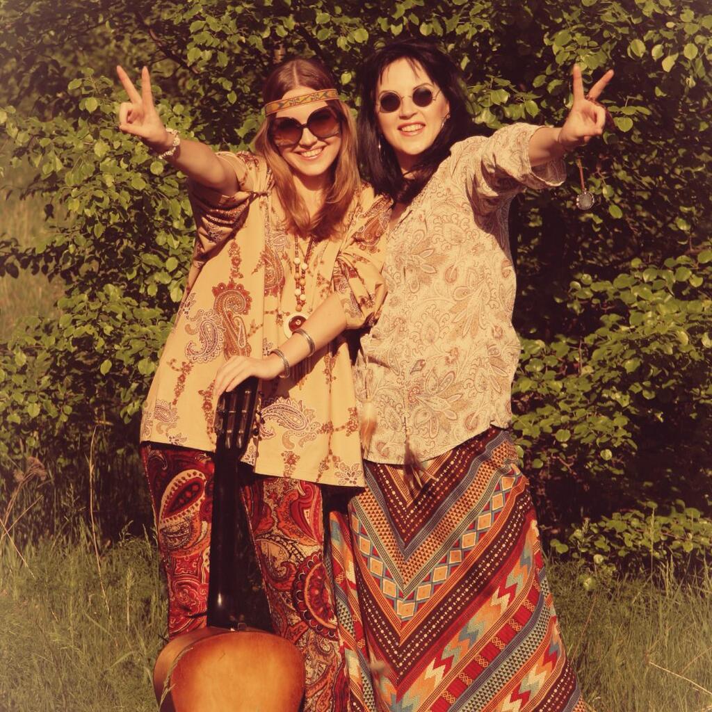 Hippie woman giving the peace sign